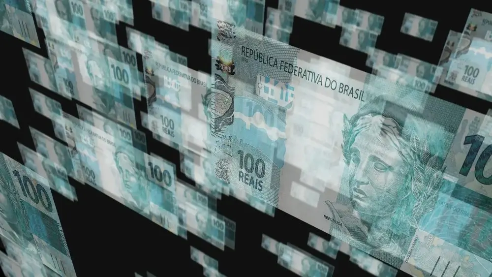 A imagem traz algumas notas de Real, moeda brasileira, 